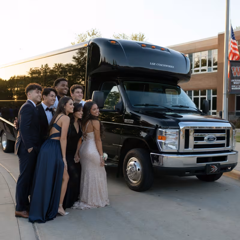 Group boarding a white charter bus for Prom & Homecoming Transportation transportation in Glendale