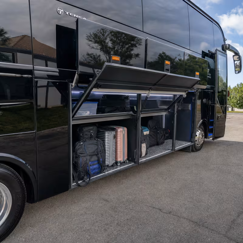 Party bus interior with wraparound leather seating and LED lighting in Glendale