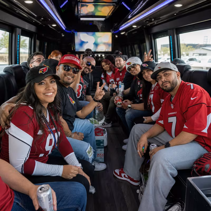 Group boarding a white charter bus for Sporting Event Transportation transportation in Glendale
