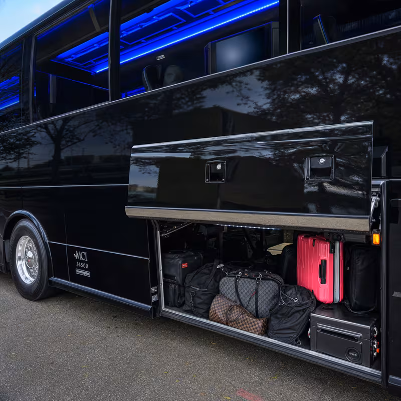 Party bus interior with wraparound leather seating and LED lighting in Glendale