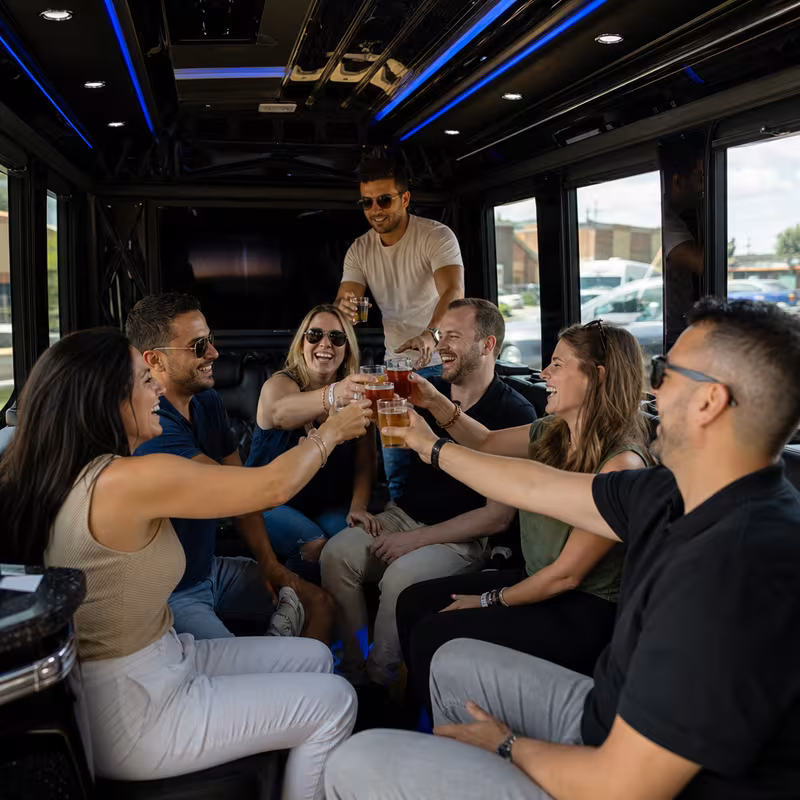 Group boarding a white charter bus for Winery & Brewery Tour Transportation transportation in Glendale